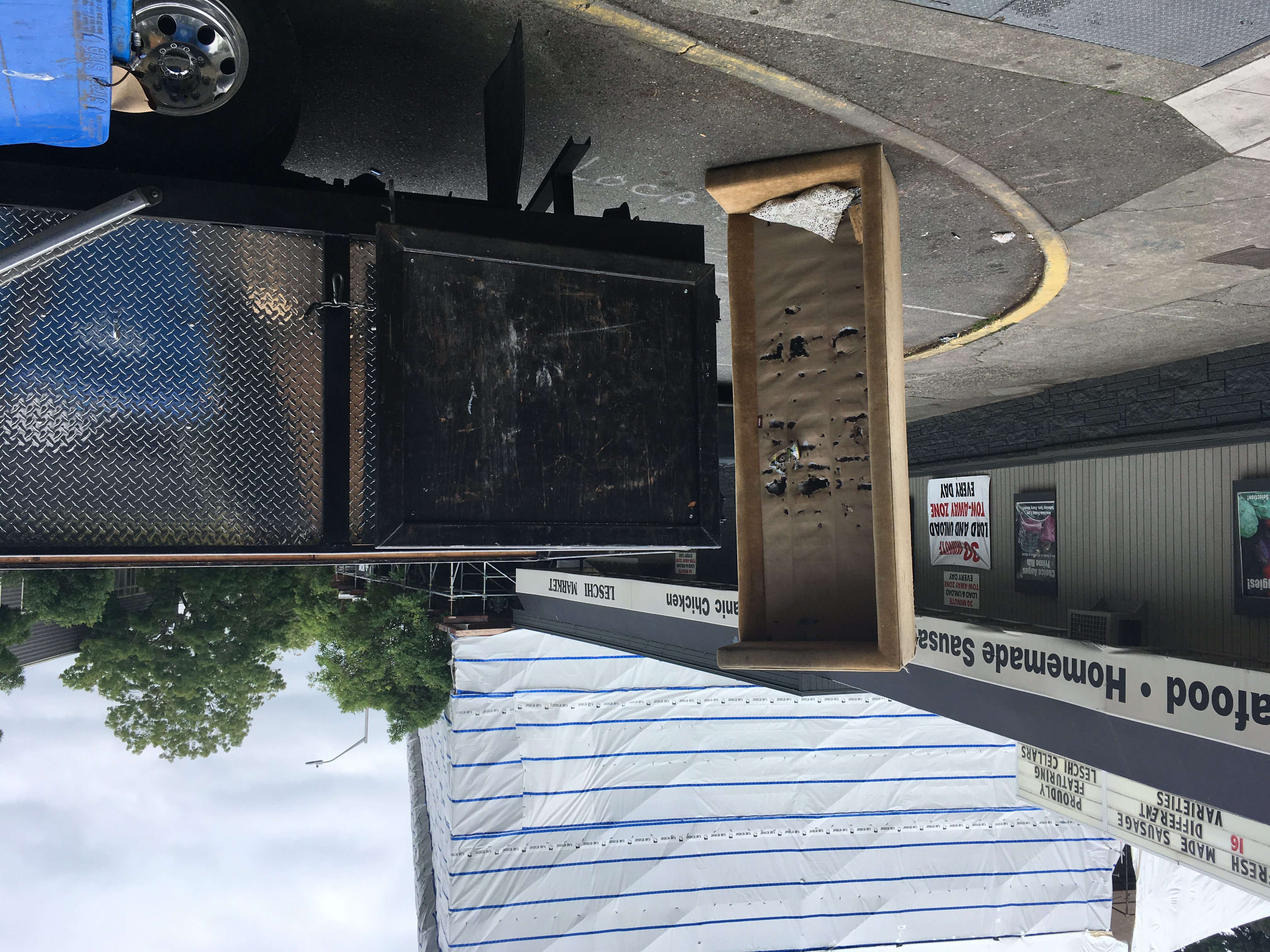 Junk removal crew hauling a couch