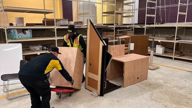 YWCA basement before cleanout - cluttered with junk