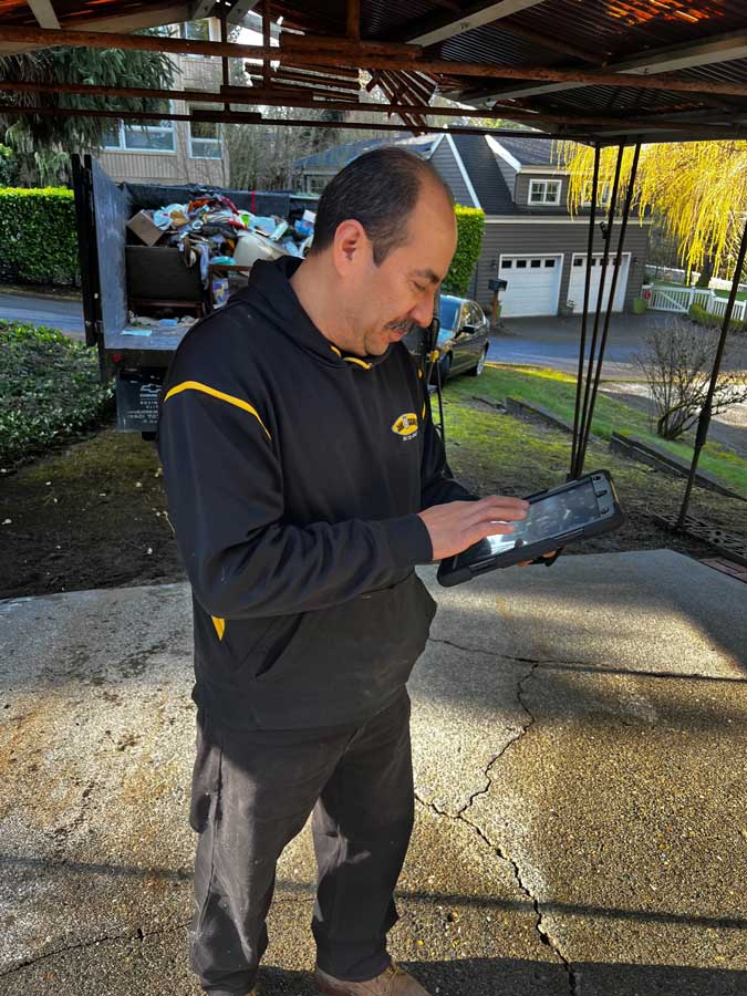 Junk Removal Cost Calculation by Junk B Gone Employee