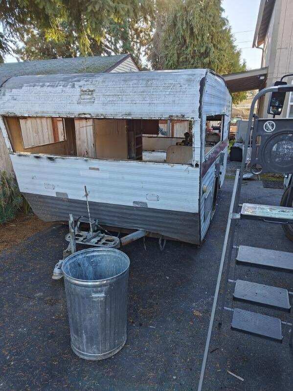 Junk RV being towed in Seattle
