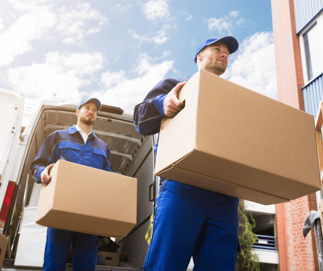 Junk removal crew loading furniture during a move