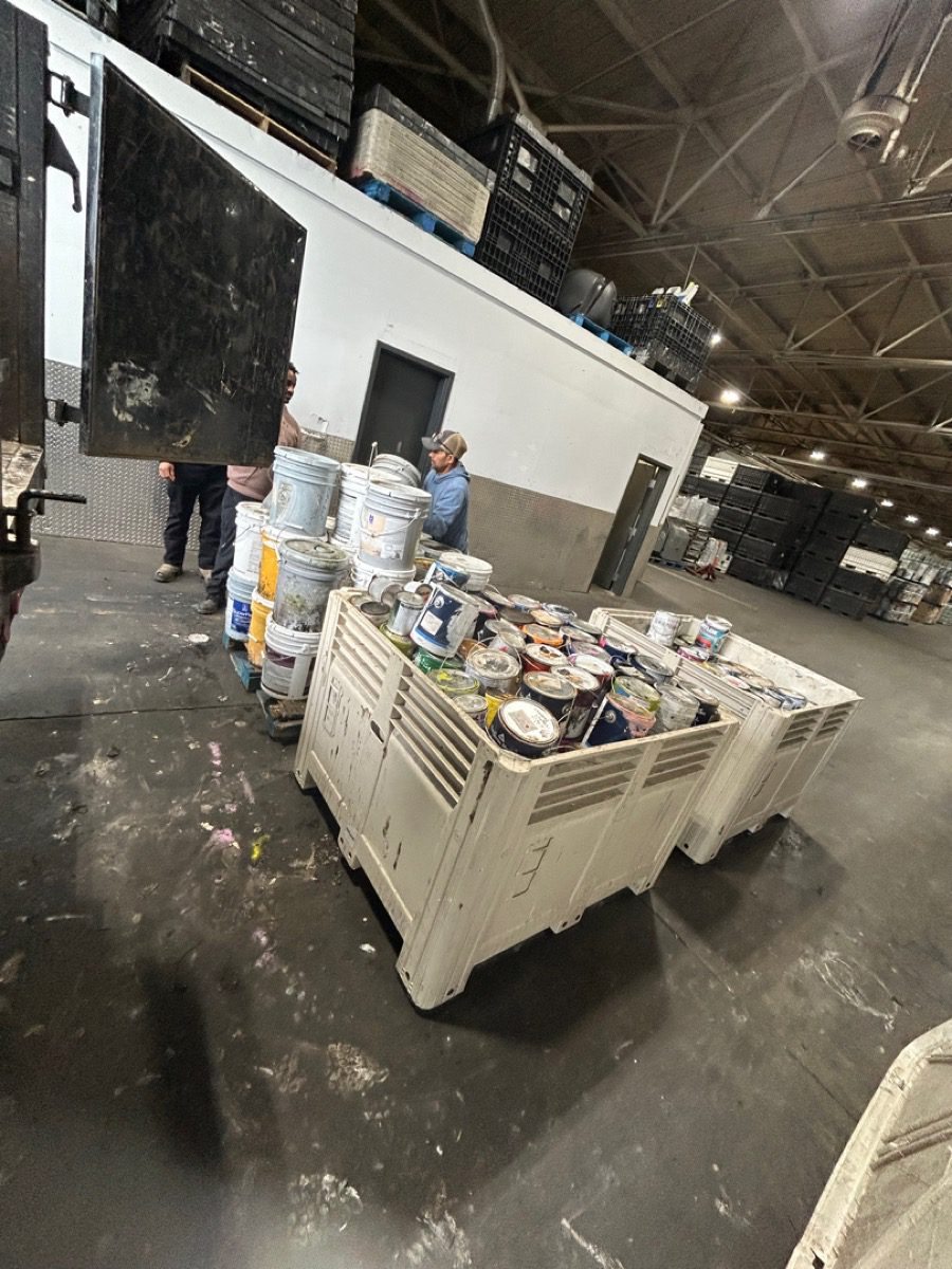 Junk B Gone crew unloading collected paint at GreenSheen recycling facility in Kent Washington
