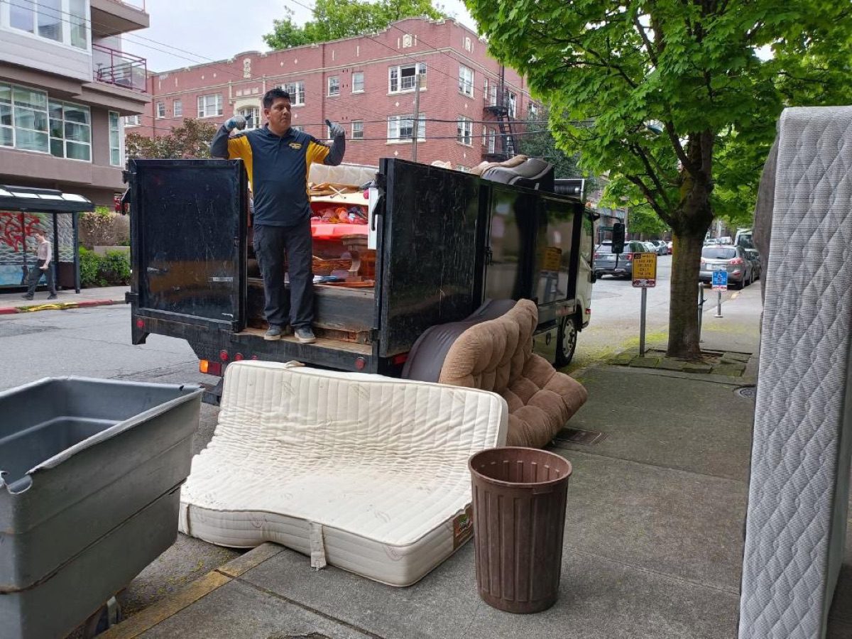 Crew loading truck — Bellevue apartment cleanout