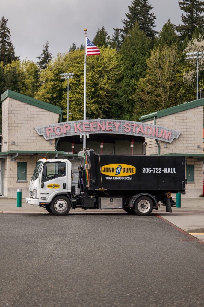 Junk B Gone truck in front of Pop Keeney Stadium in Bothell, WA — Bothell junk removal