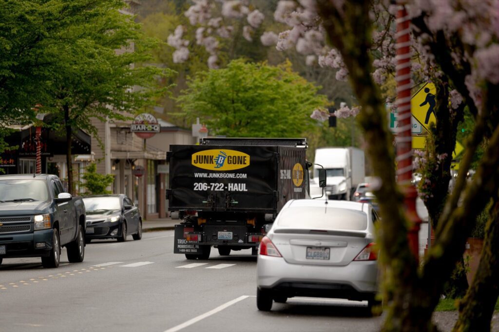 Junk B Gone truck in downtown Issaquah, WA in spring with cherry blossoms — Issaquah junk removal