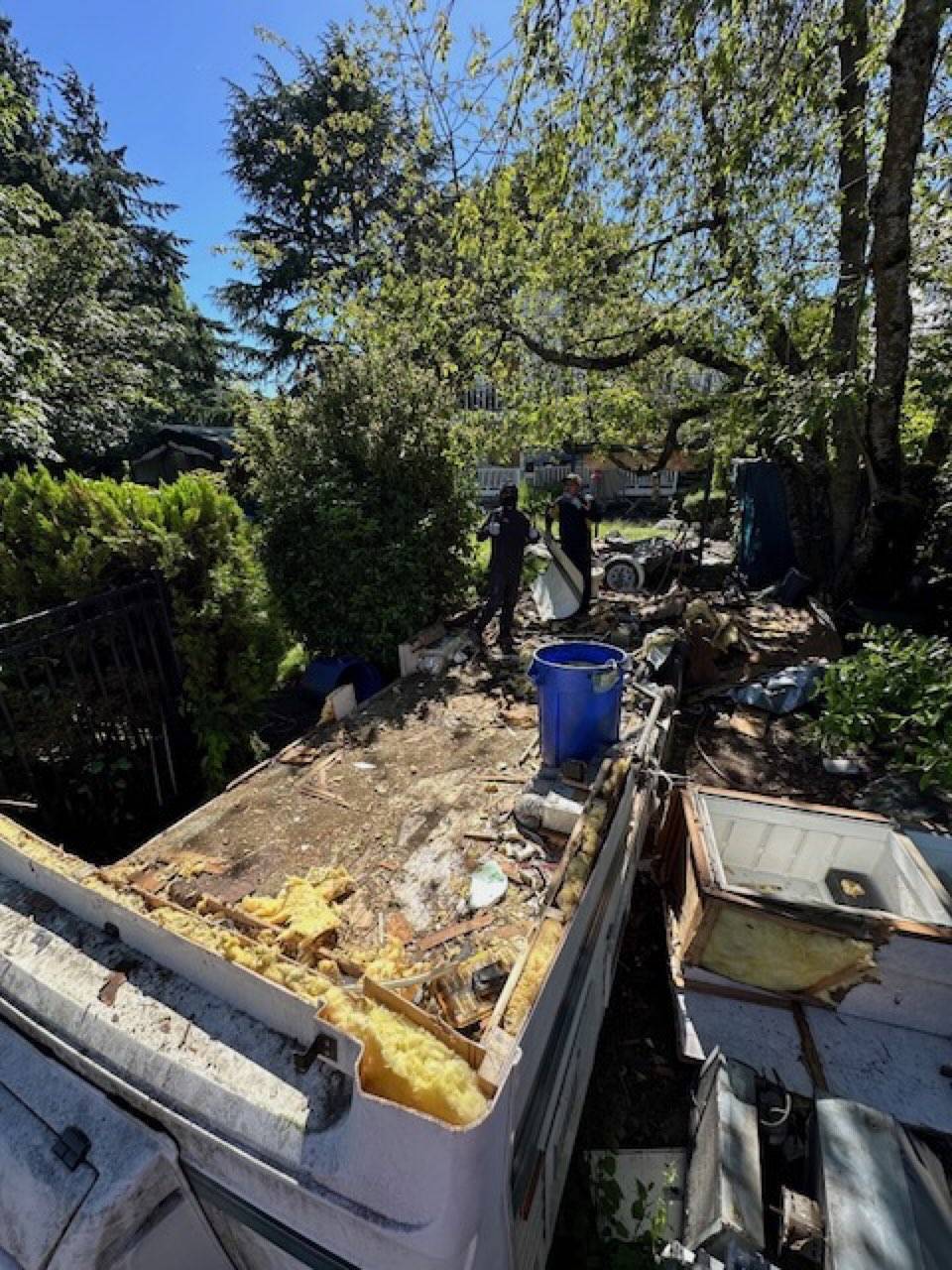 Mid-job: debris cleared from yard during RV demolition