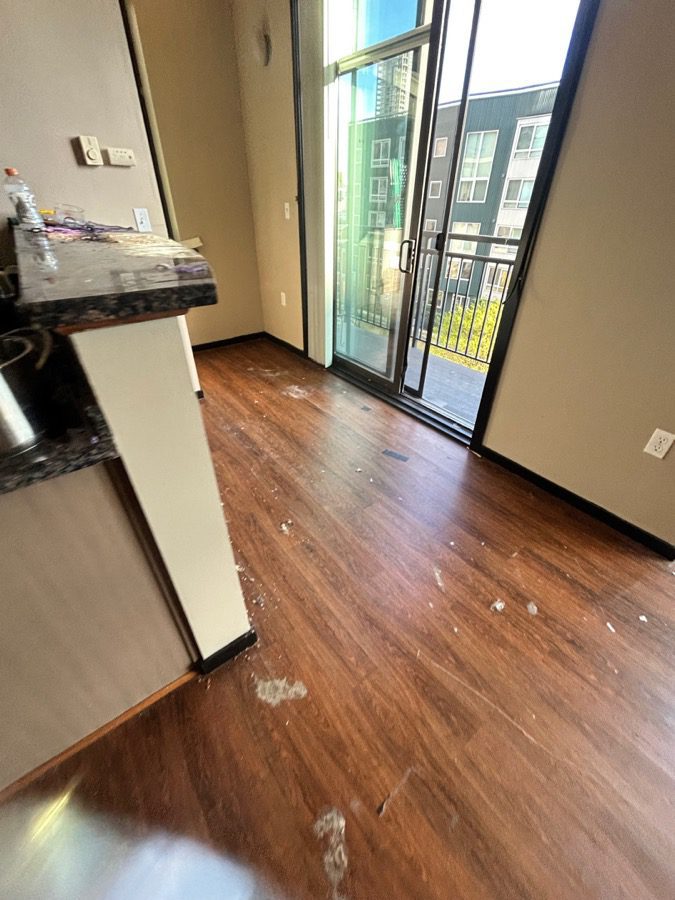 Apartment kitchen and entryway emptied and swept at Moda Apartments, Seattle