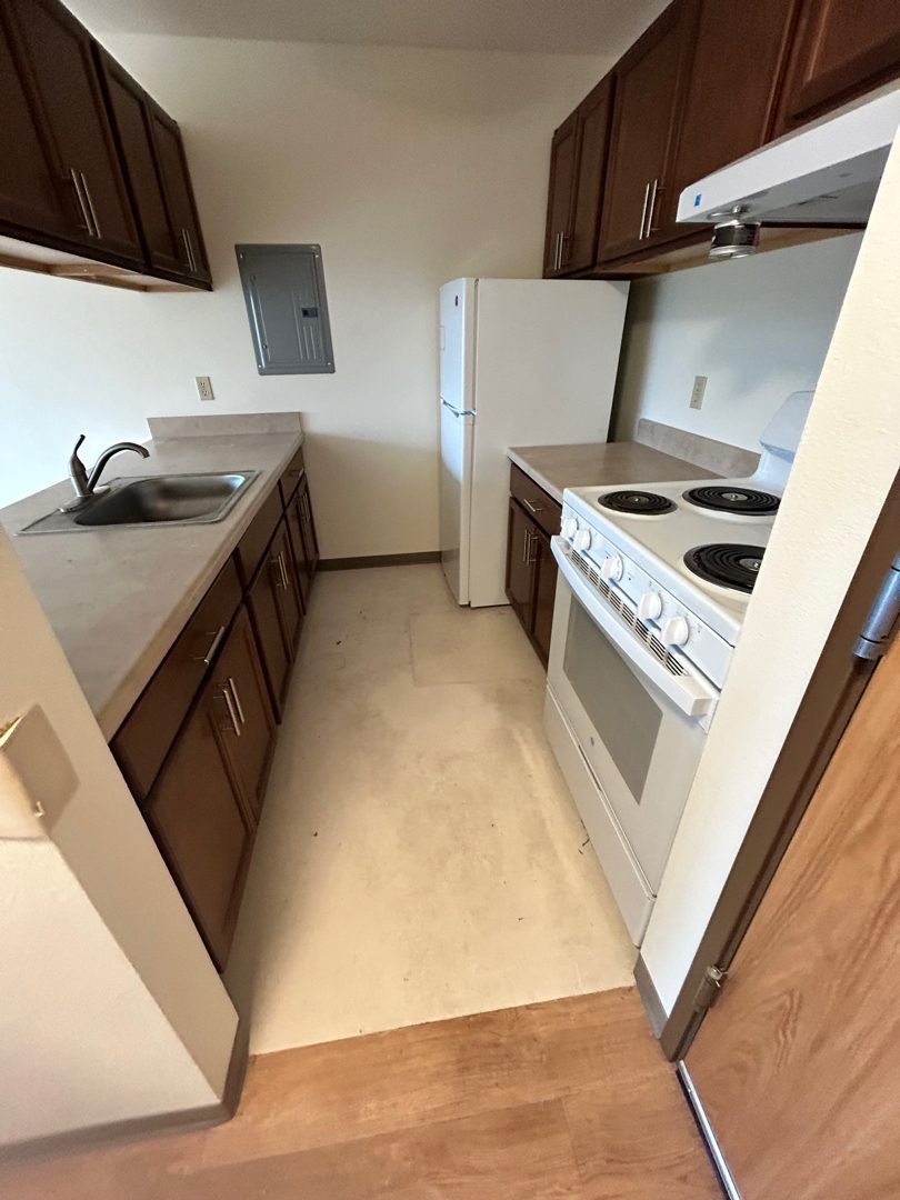 Apartment kitchen cleared and spotless at Elbert House Apartments, Bellevue