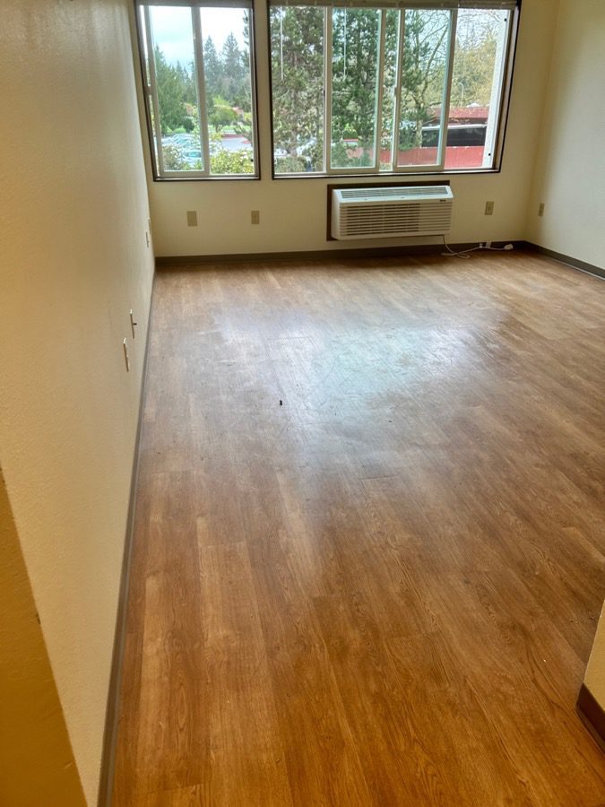 Apartment living room cleared and turn-ready at Elbert House Apartments in Bellevue