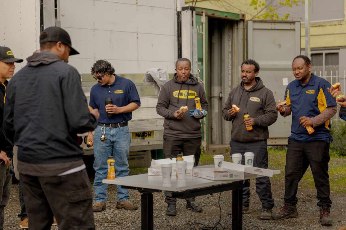 Apartment turn in Seattle - Junk B Gone crew and branded truck on a property manager's job