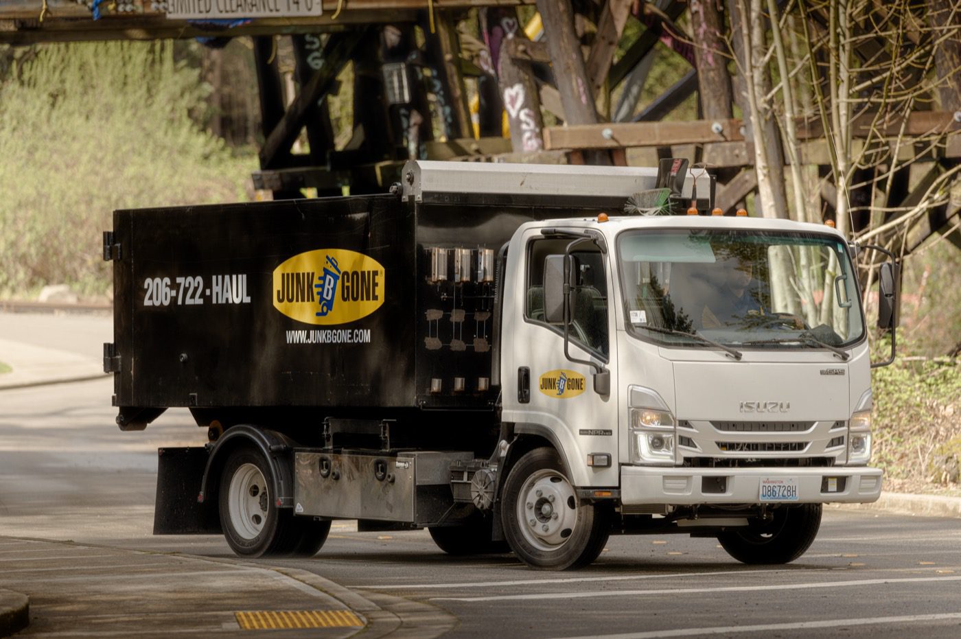 Commercial cleanout in Seattle - Junk B Gone crew and branded truck on a commercial job