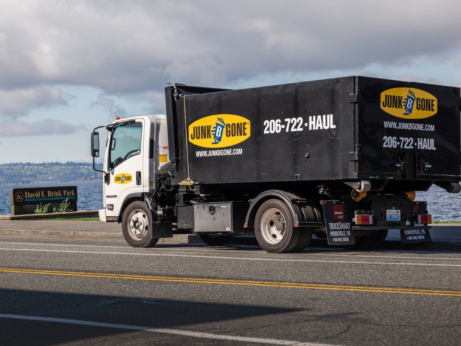Storage unit cleanout in Seattle - Junk B Gone crew and branded trucks on a job