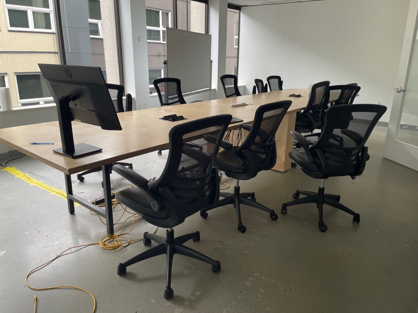 Seattle conference room with chairs and equipment before Junk B Gone removal