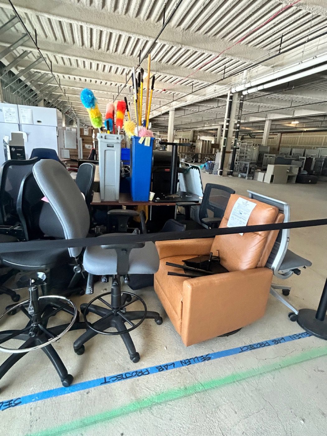 Office furniture removal in Edmonds - Junk B Gone crew staging office chairs, drafting stools and conference tables for haul-off
