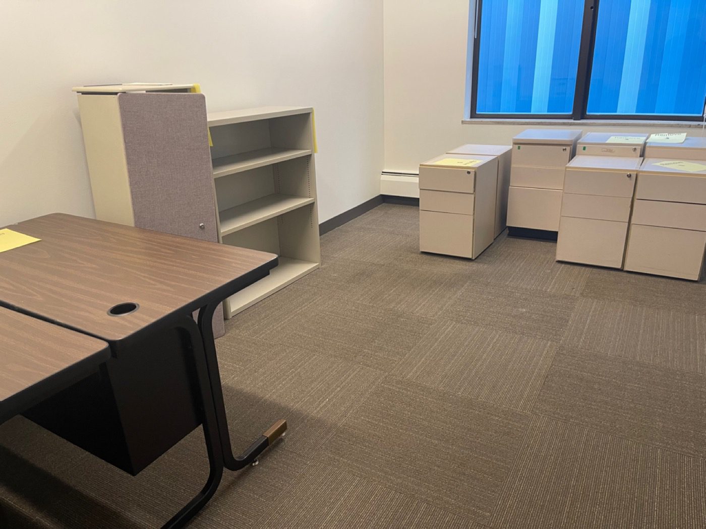Seattle office with desks, files and tagged items before clear-out by Junk B Gone