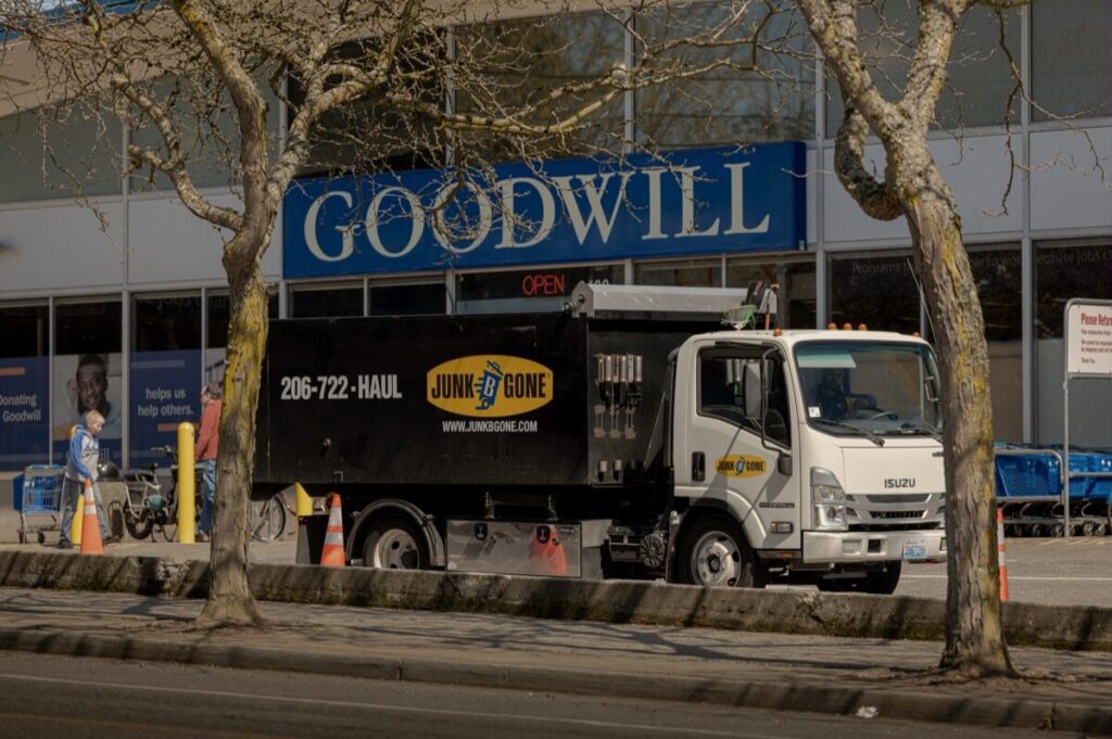 Junk B Gone truck at a Seattle Goodwill — donation pickup and junk removal