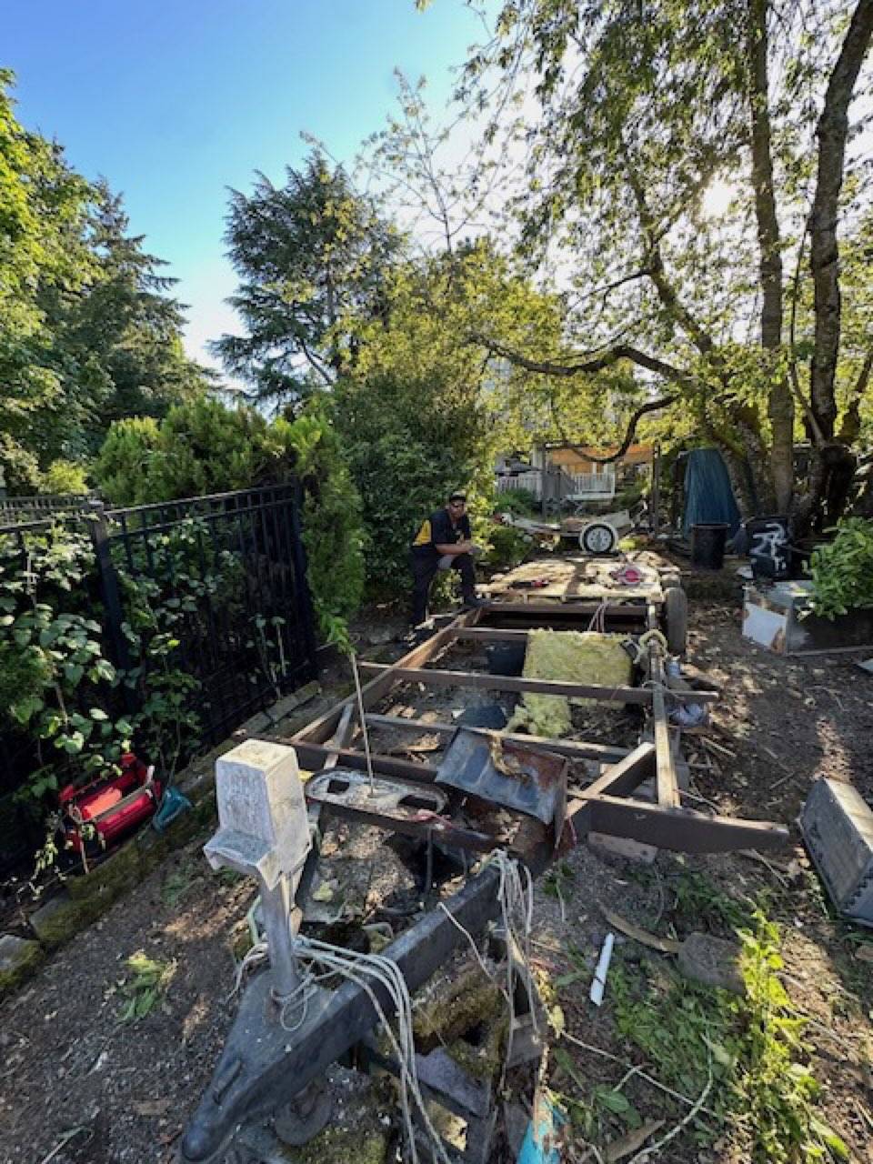 Bare RV frame ready to be hauled out of Seattle backyard