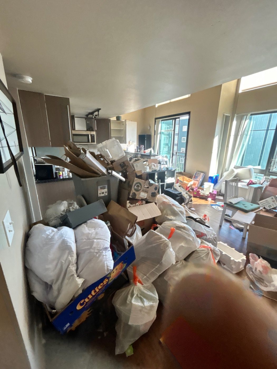 Seattle apartment unit packed with a former tenant's leftover belongings before turnover cleanout