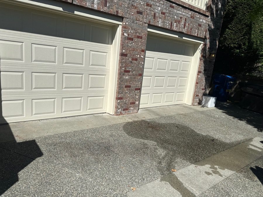 Curb appeal cleanout in Seattle - Junk B Gone cleared a driveway and garage exterior for showings