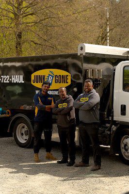 Estate cleanout in Seattle - Junk B Gone crew and branded truck on a family's home