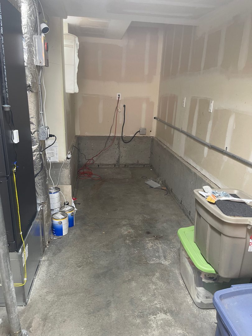 Cluttered Kirkland basement before Junk B Gone cleared it