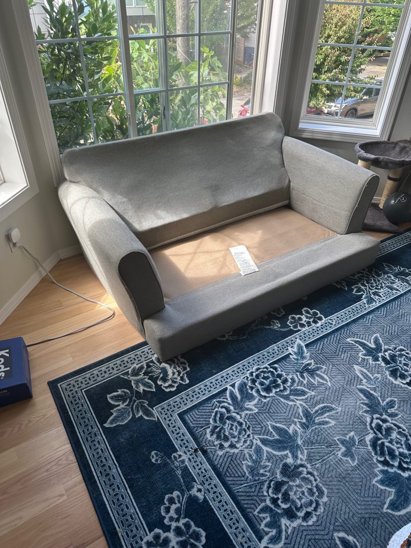 Before — the room with heavy furniture in place